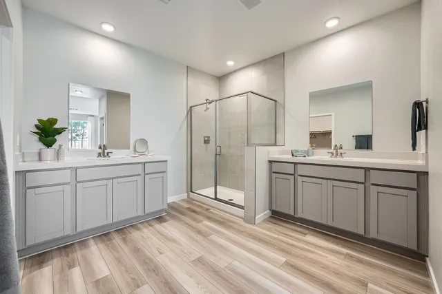 A large white kitchen with white cabinets.