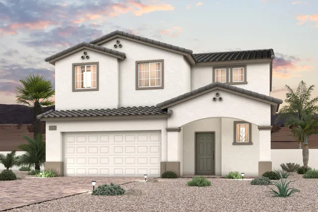 A white house with a garage.