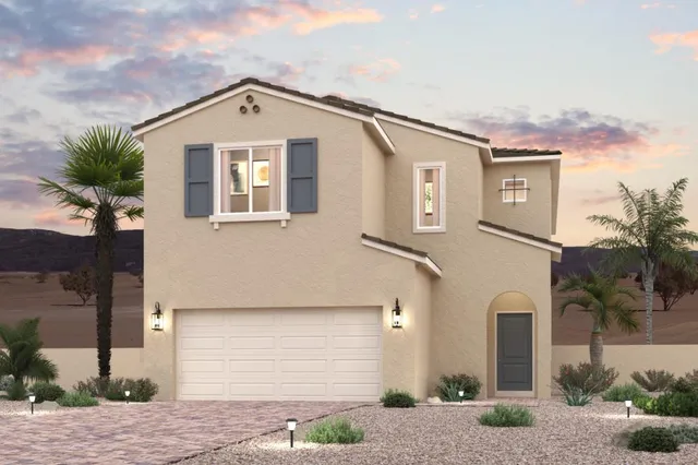 A house with a garage and palm trees.