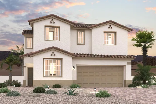 A house with a garage and palm trees.
