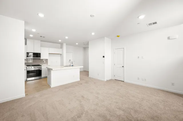 A large kitchen with white cabinets.