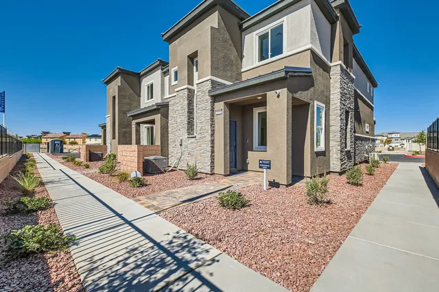 A brick building with a brick walkway.