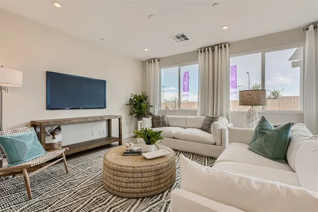 A living room with a large window.