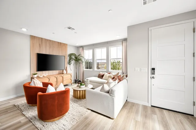 A living room with a tv and couches.