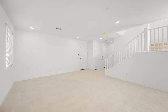 A white hallway with white walls.