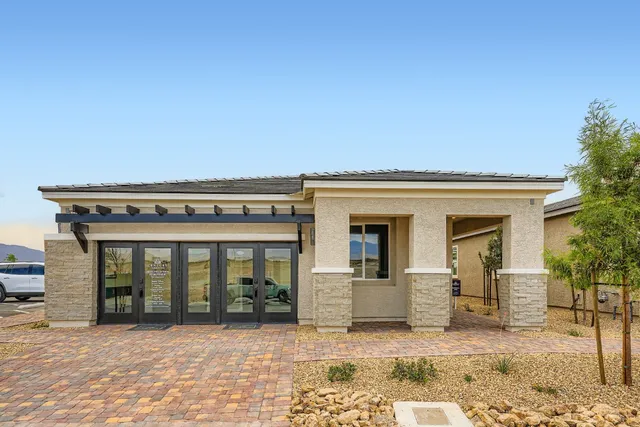 A building with a brick driveway.