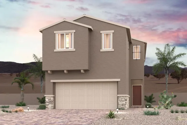 A house with a garage and palm trees.