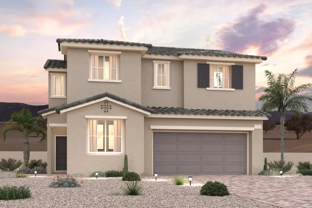 A house with a garage and palm trees.