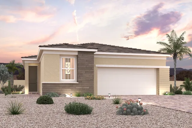 A house with a garage and trees.